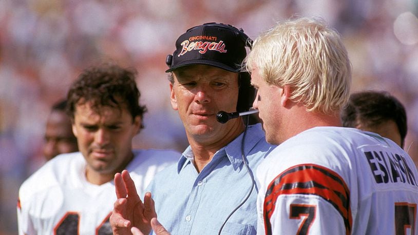 ANAHEIM, CA - OCTOBER 7: Head coach Sam Wyche of the Cincinnati Bengals talks to his quarterback Boomer Esiason #7 on the sidelines during a game against the Los Angeles Rams at the Anaheim Stadium on October 7, 1990 in Anaheim, California. The Bengals won 34-31. (Photo by George Rose/Getty Images)