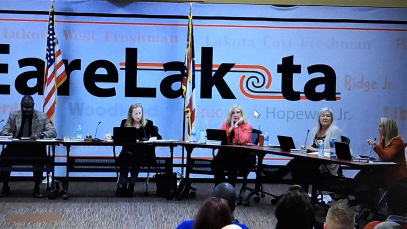 Monday evening's Lakota Board of Education meeting began with an interruption by member Darbi Boddy (pictured far right) as Board President Lynda O'Connor then responded and declared Boddy out of order for speaking over her and out of turn. Boddy saw her proposed policy on transgender athletes die for a lack of second of her motion by a 4-1 vote. O'Connor later urged the board to re-focus on student proficiency issues. (Photo By Michael D. Clark\Journal-News)
