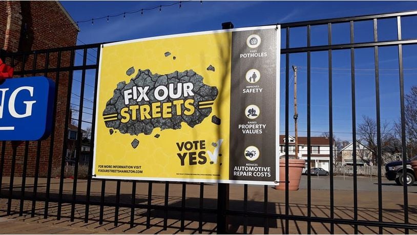 Fix Our Streets signs, supporting Hamilton s proposed street-repair levy that will be on the March 17 ballot, are going up now. They are paid for by private donations, not by city government. MIKE RUTLEDGE/STAFF