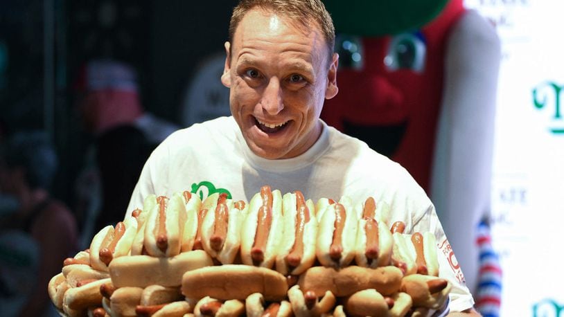 Eleven-time and defending men's champion Joey Chestnut participates in Nathan's Famous International Fourth of July hot dog eating contest weigh-in at the Empire State Building on Wednesday, July 3, 2019, in New York.