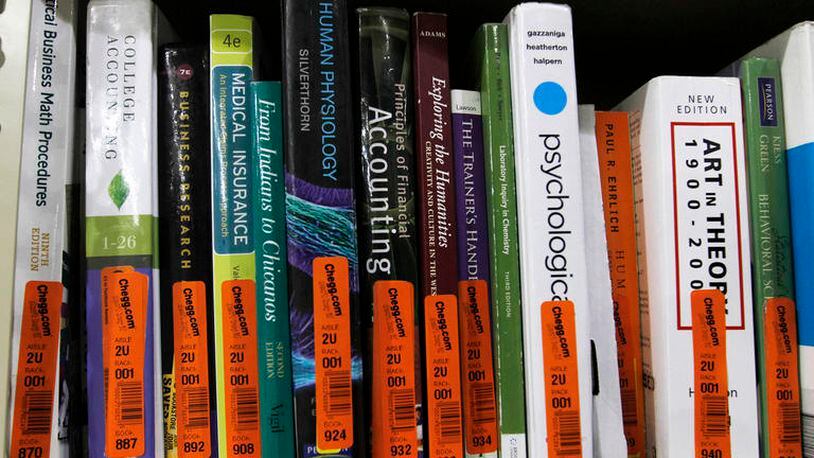 Textbooks sit on a shelf at the Chegg Inc. warehouse in Shepherdsville, Kentucky, U.S., on Thursday, April 29, 2010. No more $120 chemistry books. That’s the message from textbook-rental service Chegg Inc., which is urging college students to stop paying top dollar to buy their tomes. Photographer: John Sommers II/Bloomberg via Getty Images