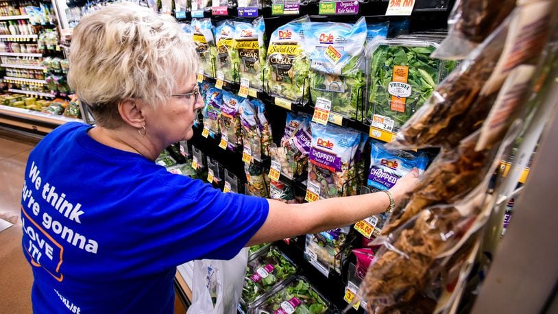 Carol Spencer collects an online grocery order for the Clicklist store pickup at Kroger Marketplace on Yankee Road in Liberty Twp. NICK GRAHAM/STAFF
