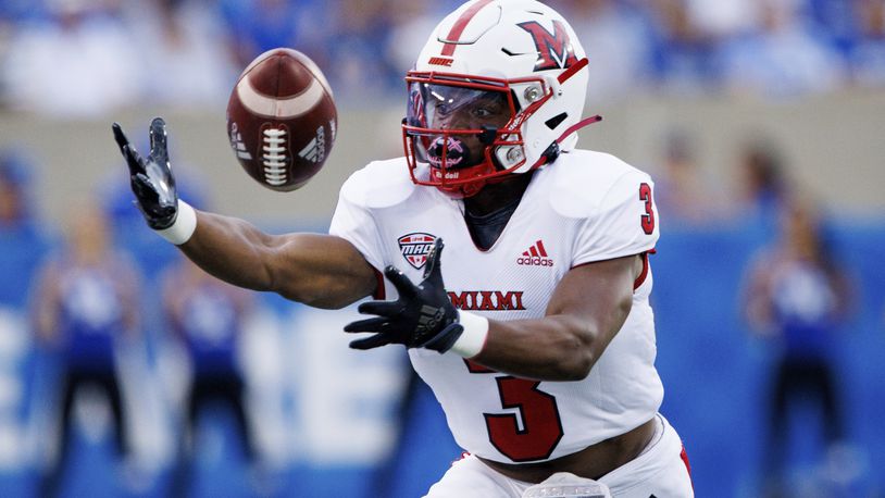 Miami (Ohio) running back Keyon Mozee reaches out and makes a catch during the first half of an NCAA college football game against Kentucky in Lexington, Ky., Saturday, Sept. 3, 2022. (AP Photo/Michael Clubb)