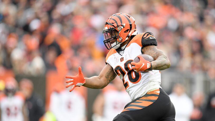 CLEVELAND, OHIO - DECEMBER 08: Running back Joe Mixon #28 of the Cincinnati Bengals runs for a gain during the second half against the Cleveland Browns at FirstEnergy Stadium on December 08, 2019 in Cleveland, Ohio. The Browns defeated the Bengals 27-19. (Photo by Jason Miller/Getty Images)