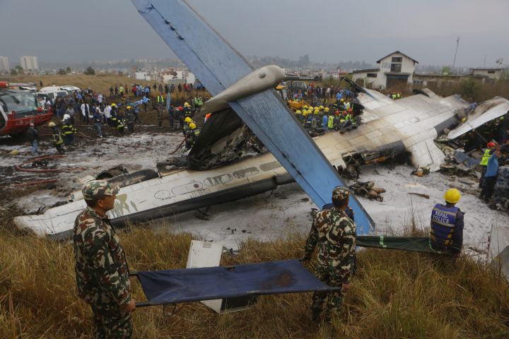 Photos: Kathmandu plane crash kills dozens, Nepal police say