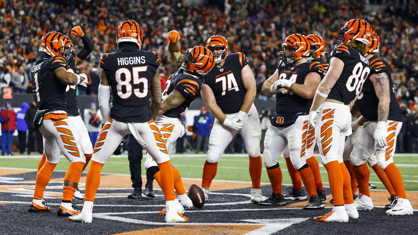 Bengals offense celebrates a touchdown by wide receiver Ja'Marr Chase during Cincinnati's AFC Wild Card playoff game against the Baltimore Ravens Sunday, Jan. 15, 2023 at Paycor Stadium in Cincinnati. The Bengals won 24-17. NICK GRAHAM/STAFF