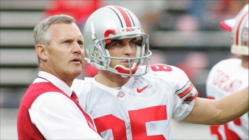 RALEIGH, NC - SEPTEMBER 18:  Head coach Jim Tressel of the Ohio State Buckeyes talks with kicker Mike Nugent #85 during the game against the North Carolina State Wolfpack on September 18, 2004 at Carter-Finley Stadium Stadium in Raleigh, North Carolina. (Photo by Grant Halverson/Getty Images) *** Local Caption *** Jim Tressel;Mike Nugent