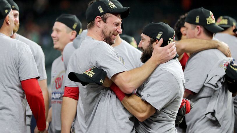 The Nationals’ Max Scherzer and Adam Eaton celebrate after defeating the Houston Astros 6-2 in Game Seven to win the 2019 World Series in Game Seven of the 2019 World Series at Minute Maid Park on October 30, 2019 in Houston, Texas. (Photo by Elsa/Getty Images)