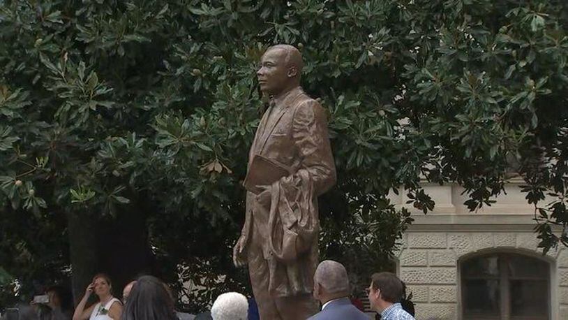 An 8-foot statue of civil rights icon Martin Luther King Jr. was unveiled at the Georgia state capitol Monday.