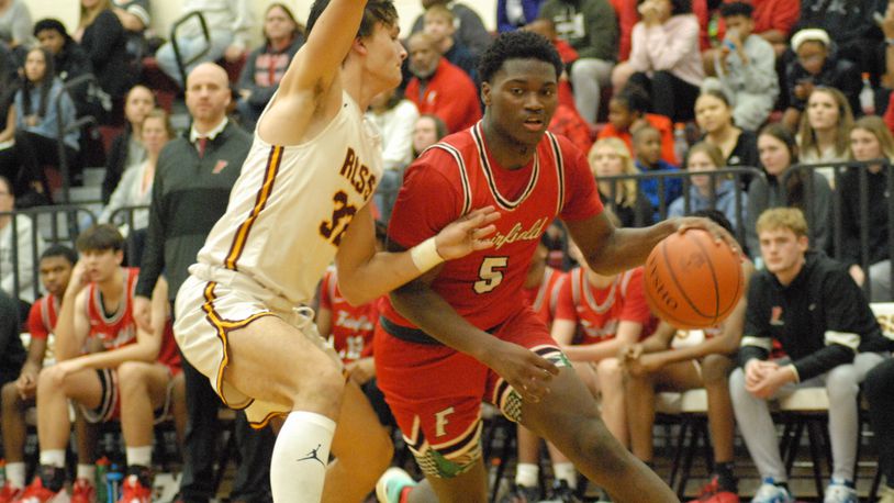 Fairfield senior Ray Coney drives to the basket against Ross senior Kellen Reid during their game on Dec. 30, 2022. Chris Vogt/CONTRIBUTED