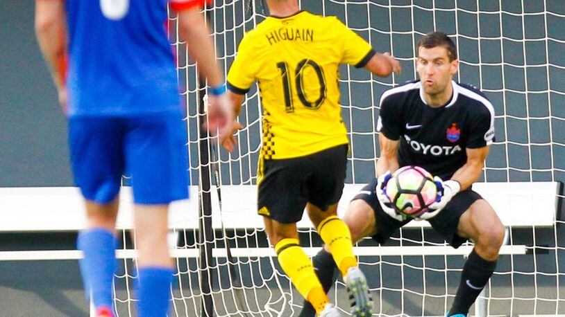 FC Cincinnati goalie Mitch Hildebrandt (1) stops a shot during their Open Cup match against the Columbus Crew, held at Nippert Stadium on the campus of the University of Cincinnati in June. GREG LYNCH / STAFF