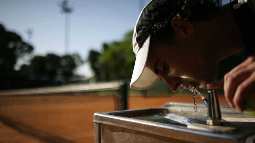 A student drinks from the water fountain at the Villas tennis club in Buenos Aires, Argentina, in a 2008 file photo.
