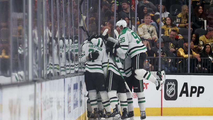 Dallas Stars center Matt Duchene (95) celebrates with teammates after a game winning goal by center Wyatt Johnston (53) during overtime against the Vegas Golden Knights in Game 3 of an NHL hockey Stanley Cup first-round playoff series Saturday, April 27, 2024, in Las Vegas. (AP Photo/Ian Maule)