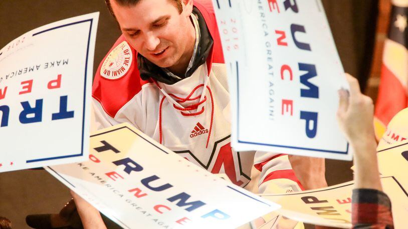 Donald Trump Jr., the son of Republican presidential candidate Donald Trump, campaigned at the Brick Street Bar in Oxford, Monday, Oct. 24, with many Miami University students in attendance. Trump was presented with a Miami University hockey jersey during the event. GREG LYNCH / STAFF