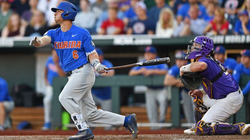 OMAHA, NE - JUNE 26:  Third basemen Jonathan India #6 of the Florida Gators hits a two run double against the LSU Tigers in the third inning during game one of the College World Series Championship Series on June 26, 2017 at TD Ameritrade Park in Omaha, Nebraska.  (Photo by Peter Aiken/Getty Images)