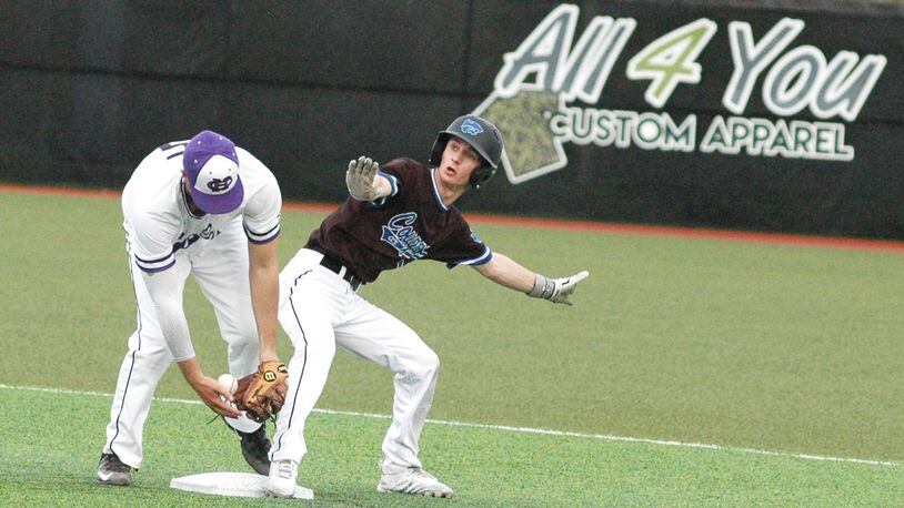 Cincinnati Christian's Alex Johnson is safe at second base despite the efforts of Cincinnati Hills Christian Academy's Colin Ames during Thursday's Miami Valley Conference baseball game at Prasco Park's Legacy Field in Mason. CHCA won 3-2. RICK CASSANO/STAFF