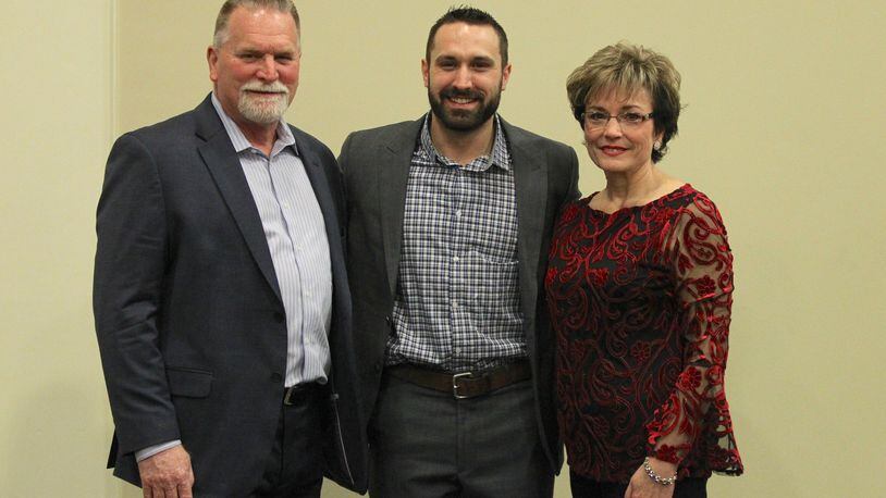 Adam Eaton stands with his parents, Glenn, left, and Robin, right, at the Springfield/Clark County Baseball Hall of Fame banquet in 2018 in Springfield. David Jablonski/Staff