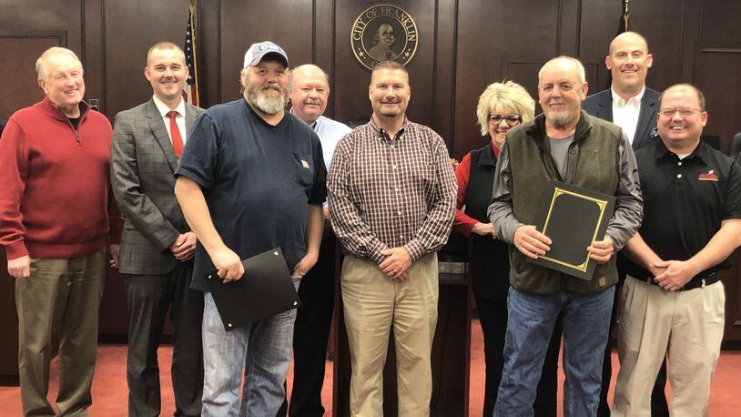 Two Franklin residents, Thomas Roach and William “Tommy” Roberts, recently received a proclamation for their heroic service to the community that deserves special recognition.Mayor Todd Hall recognized both men for their courageous action on Nov. 16 in assisting Officer Patrick Holland apprehend a suspect who was possibly overdosing on drugs who tried to run away, fight, resist and disarm the officer. Roach and Roberts assisted Holland until additional police officers arrived at the McDonald’s restaurant.From left, Councilman Paul Ruppert, Vice Mayor Brent Centers, Thomas Roach, Councilman Denny Centers, Mayor Todd Hall, Councilwoman Debbie Fouts, William “Tommy” Roberts, Councilman Michael Aldridge, and Councilman Matt Wilcher. CONTRIBUTED