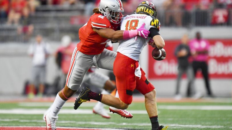 COLUMBUS, OH - OCTOBER 7: Chase Young #2 of the Ohio State Buckeyes hits quarterback Max Bortenschlager #18 of the Maryland Terrapins in the backfield causing a fumble in the third quarter at Ohio Stadium on October 7, 2017 in Columbus, Ohio. Ohio State defeated Maryland 62.14. (Photo by Jamie Sabau/Getty Images)