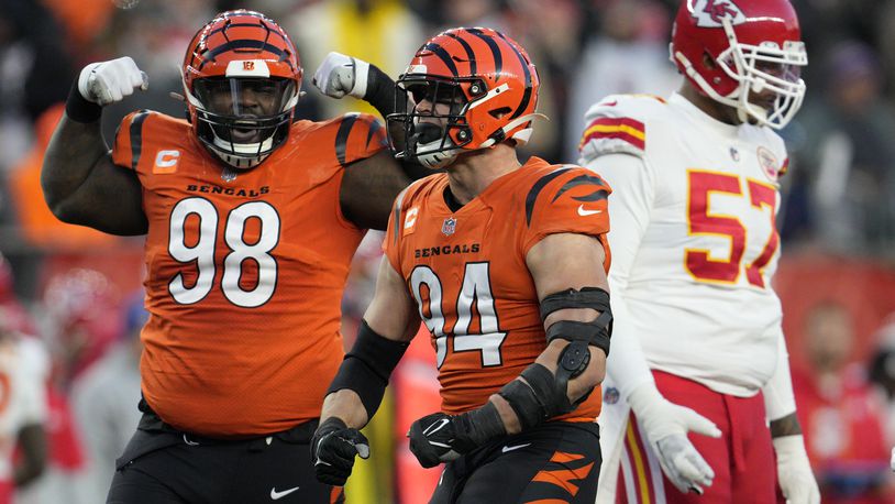 Cincinnati Bengals defensive end Sam Hubbard (94) and defensive tackle DJ Reader (98) celebrate a sack against the Kansas City Chiefs in the first half of an NFL football game in Cincinnati, Sunday, Dec. 4, 2022. (AP Photo/Jeff Dean)