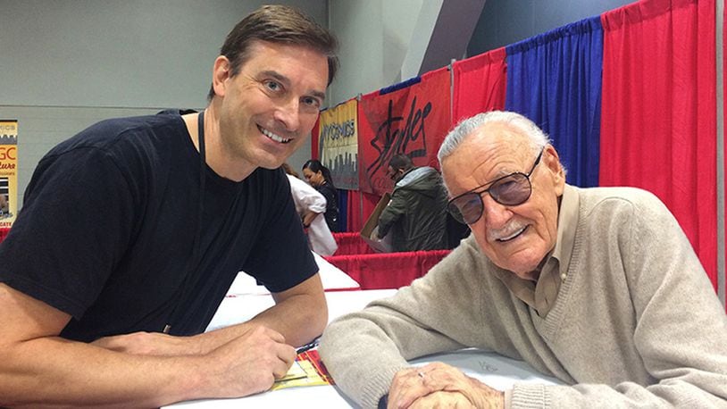 Miami University Visiting Professor Robert Batchelor wrote a book about American comic book icon Stan Lee (right), who died Monday at the age of 95. Batchelor’s 2017 book — “Stan Lee: The Man Behind Marvel” — includes an examination of Lee’s sweeping, multi-industry impacts since the 1960s. The two are pictured at the Cincinnati Comic Expo in 2016.