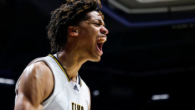 Centerville's Jonathan Powell celebrates his slam dunk during their Division I regional final basketball game against Fairfield Saturday, March 11, 2023 at Xavier University's Cintas Center. Centerville won 64-53. NICK GRAHAM/STAFF
