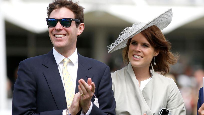 Princess Eugenie and Jack Brooksbank (L) attend day three of the Qatar Goodwood Festival at Goodwood Racecourse on July 30, 2015 in Chichester, England.