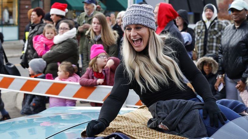 Kayla Harrison served as grand marshal for the Santa Parade kicking off Middletown Holiday Whopla events Saturday, Nov. 27, 2021 in downtown Middletown. NICK GRAHAM / STAFF