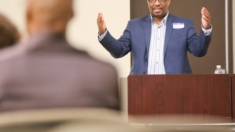Dr. Matthew Smith talks during a Celebrating Fathers & Families conference. He would like to see more fathers become involved in the fight against infant mortality.