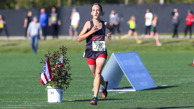 Lakota West High School freshman Evelyn Prodoehl placed eighth in the Division I girls race at the at the Ohio High School Athletic Association Cross Country Championships at Fortress Obetz. Michael Cooper/CONTRIBUTED