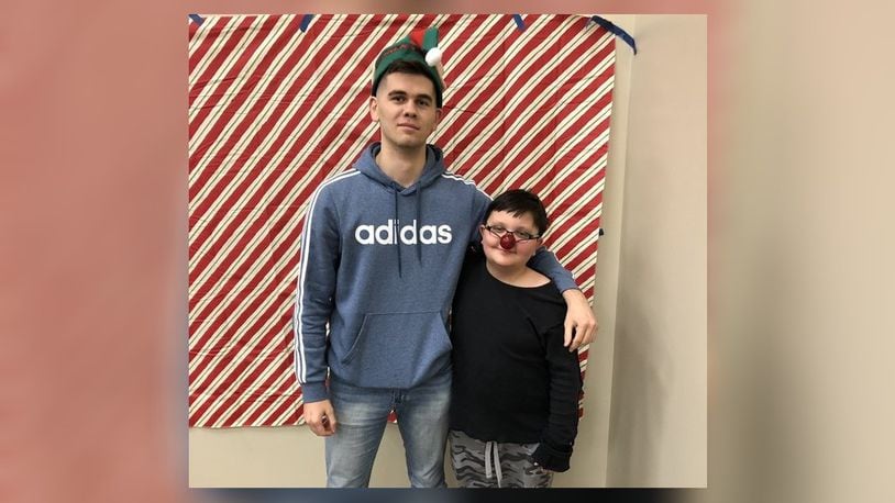 Dzhamal Sarvalov, 23, of Liberty Twp., was matched with Mikhail Stepp, 11, of Hamilton, last year through the Butler County Big Brothers/Big Sisters program. They attended the organization’s holiday party last year. SUBMITTED PHOTO