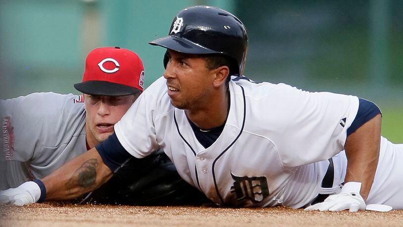 DETROIT, MI - JUNE 15: Jon Moscot #46 of the Cincinnati Reds and Anthony Gose #12 of the Detroit Tigers lie at second base after Moscot made a diving tag on Gose during the first inning at Comerica Park on June 15, 2015 in Detroit, Michigan. Moscot dislocated his left, non-throwing shoulder on the play. (Photo by Duane Burleson/Getty Images)