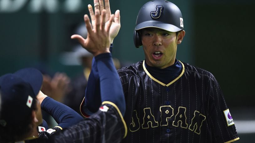 Outfielder Shogo Akiyama celebrates after scoring a run after the single by Yoshitomo Tsutsugoh in the top of the sixth inning during the SAMURAI JAPAN Send-off Friendly Match between CPBL Selected Team and Japan at the Yafuoku Dome on March 1, 2017 in Fukuoka, Japan.  (Photo by Matt Roberts/Getty Images)