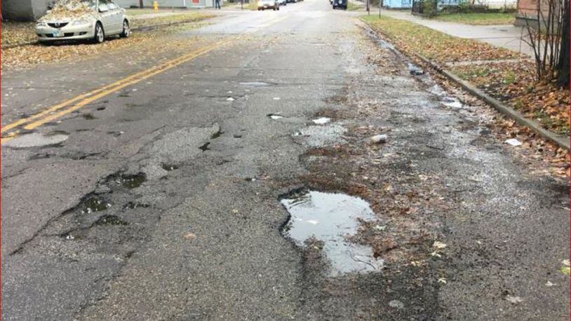 Many Hamilton streets have potholes, and many haven’t been repaved in 40 years. MIKE RUTLEDGE/STAFF