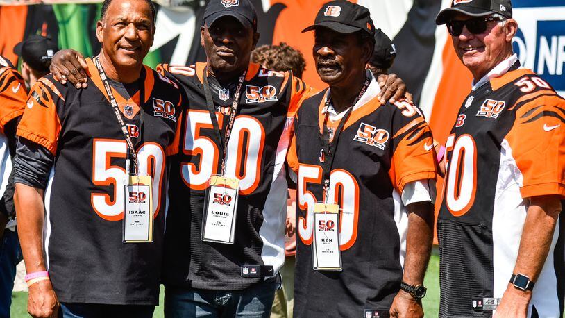 Former Bengals players (L to R) Isaac Curtis, Louis Breeden, Ken Riley and Ken Anderson gather before they are recognized at halftime on Sept. 10, 2017, at Paul Brown Stadium in Cincinnati. Riley, who played 15 seasons for the Bengals, died Sunday. He was 72. NICK GRAHAM/STAFF