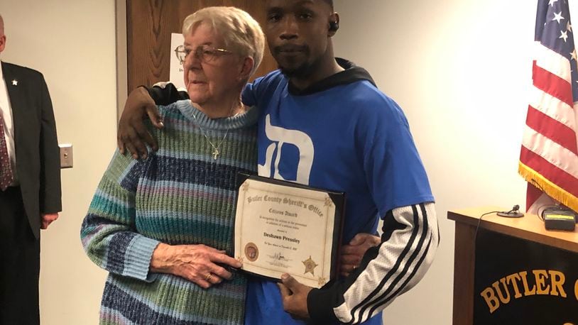 Deshawn Pressley, 27, of Middletown, received a "Citizens Award" from Butler County Sheriff Richard Jones Thursday. Pressley chased down a man who allegedly stole a purse belonging to Patricia Goins, 87, of Trenton, while they were shopping at Kroger on Oxford State Road. RICK McCRABB/STAFF