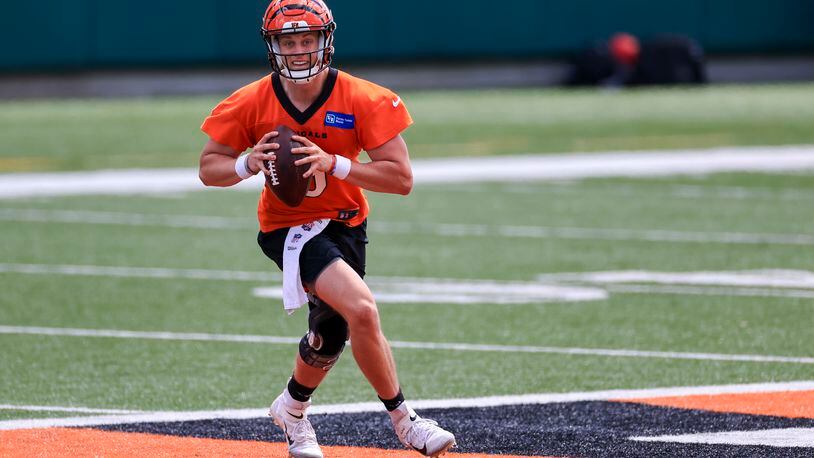 Cincinnati Bengals' Joe Burrow looks to pass in a drill during an NFL football minicamp practice in Cincinnati, Tuesday, June 15, 2021. (AP Photo/Aaron Doster)
