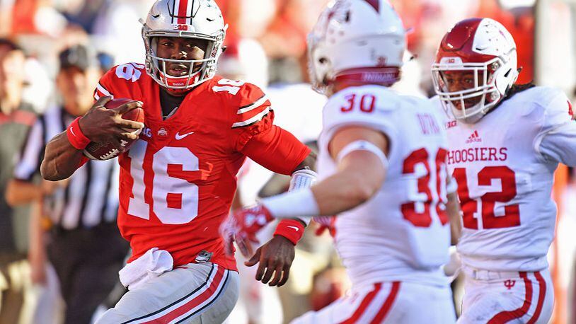 COLUMBUS, OH - OCTOBER 8: Quarterback J.T. Barrett #16 of the Ohio State Buckeyes picks up 27 yards in the second quarter against the Indiana Hoosiers to set up the Buckeyes’ second touchdown at Ohio Stadium on October 8, 2016 in Columbus, Ohio. (Photo by Jamie Sabau/Getty Images)