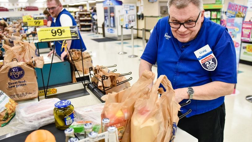 Craig Gordon, 75, a West Chester Twp. man with special needs, bags groceries at Kroger on Ohio 747 in West Chester Twp.Gordon has worked there for nearly two decades and is retiring. NICK GRAHAM/STAFF