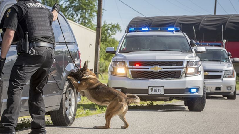 The Warren County Drug Task Force partners with several communities and local law enforcement agencies and Ohio State Highway Patrol troopers and their K9s to detect and seize illegal drugs being transported in the county. FILE PHOTO