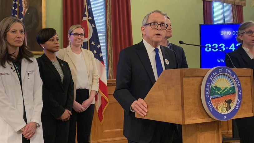 Gov. Mike DeWine and other administration leadership address the latest in the coronavirus outbreak response. LAURA BISCHOFF/STAFF