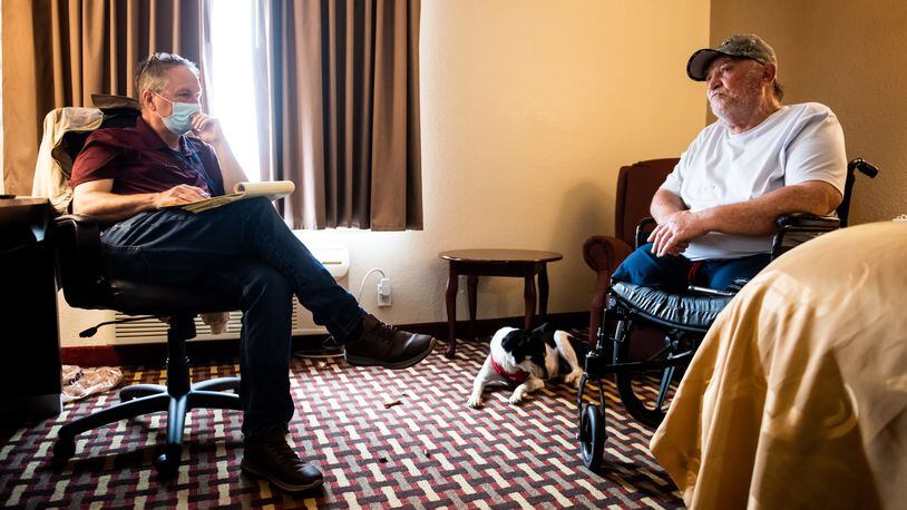 Army veteran Charles Knuckles tells his story about how he ended up staying at a hotel in Middletown. Knuckles lost his legs due to complications from injuries he sustained in the Army. NICK GRAHAM / STAFF