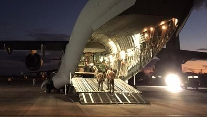 Airmen prepare to offload a Wright Patt C-17 delivering troops and supplies Sept. 12, 2017 at Homestead Air Reserve Base, Fla. BARRIE BARBER/STAFF