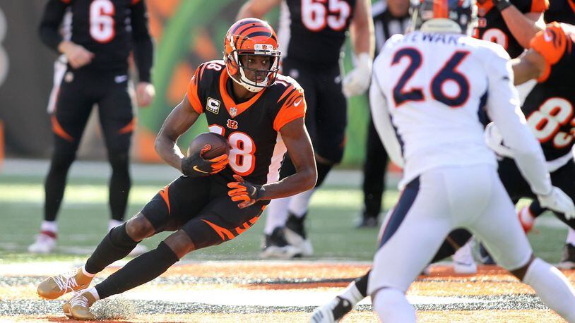 A.J. Green of the Cincinnati Bengals runs with the ball during the first quarter of the game against the Denver Broncos at Paul Brown Stadium last December in Cincinnati. (Photo by John Grieshop/Getty Images)