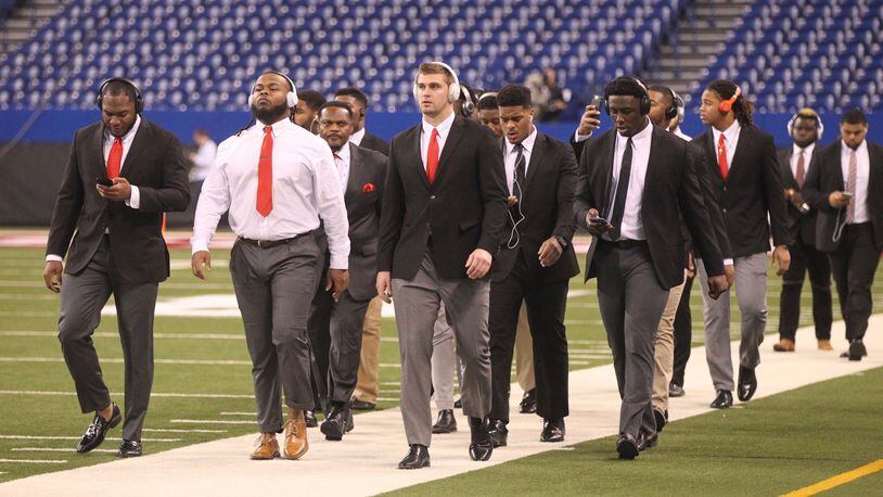 Ohio State’s defensive linemen arrive at Lucas Oil Stadium on Dec. 2, 2017, before a game against Wisconsin in Indianapolis. David Jablonski/Staff