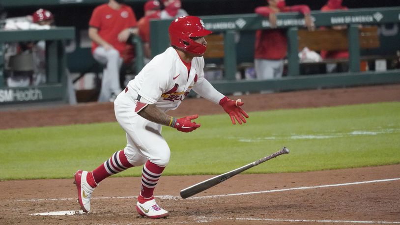 St. Louis Cardinals' Kolten Wong drops his bat after hitting a walk-off single to defeat the Cincinnati Reds in a baseball game Thursday, Aug. 20, 2020, in St. Louis. (AP Photo/Jeff Roberson)