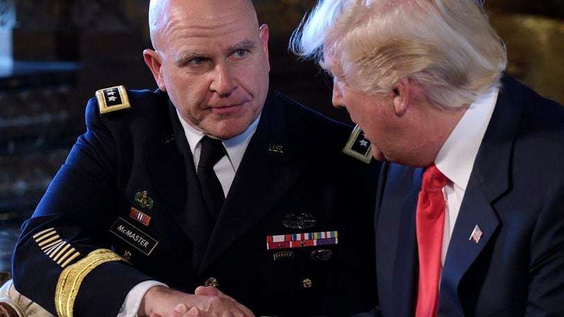 President Donald Trump, right, shakes hands with Army Lt. Gen. H.R. McMaster, left, at Trump's Mar-a-Lago estate in Palm Beach, Fla., Monday, Feb. 20, 2017, where he announced that McMaster will be the new national security adviser. (AP Photo/Susan Walsh)