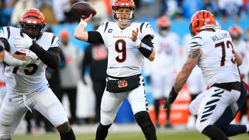 Cincinnati Bengals quarterback Joe Burrow (9) pases from the pocket against the Tennessee Titans during the first half of an NFL divisional round playoff football game, Saturday, Jan. 22, 2022, in Nashville, Tenn. (AP Photo/John Amis)