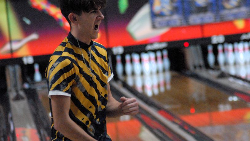 Monroe senior Trey Lambert celebrates a strike against Ross on Monday at Northwest Lanes. Lambert and the Hornets are 19-0 on the season. Chris Vogt/CONTRIBUTED