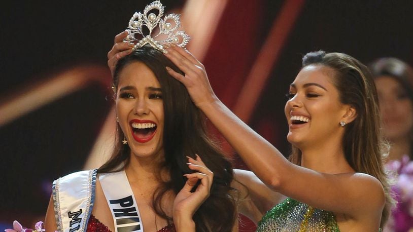 Catriona Gray of the Philippines, left, reacts as she is crowned the new Miss Universe 2018 by Miss Universe 2017 Demi-Leigh Nel-Peters during the final round of the 67th Miss Universe competition in Bangkok, Thailand, Monday, Dec. 17, 2018.